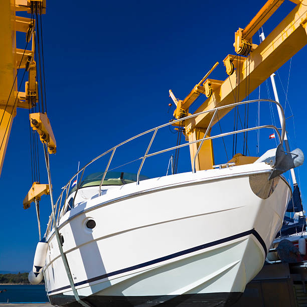 motor yacht hanging on a harbour craneCHECK OTHER SIMILAR IMAGES IN MY PORTFOLIO....